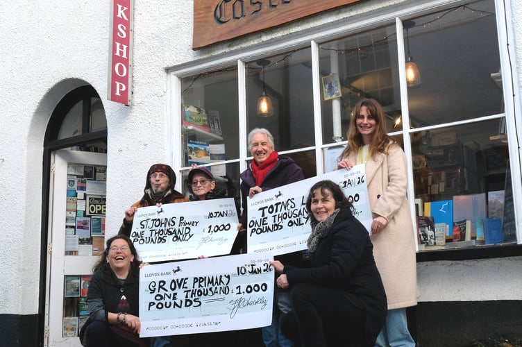 Totnes Library Supervisor Rosie Johnson, (back, right) and Poetry Pop-Up Shop organiser Harula Ladd (front, left) with members of the Castle Books volunteer team.